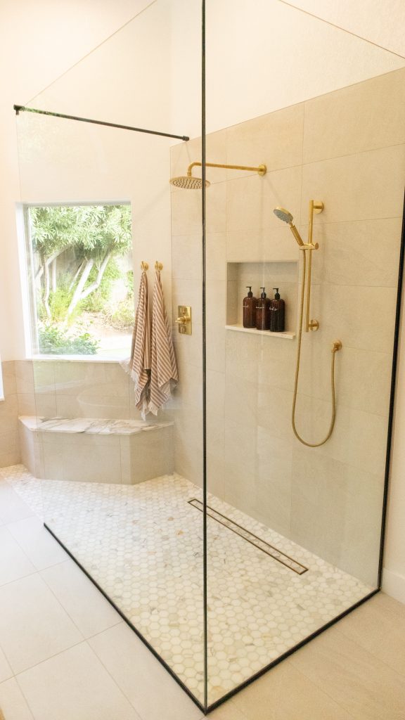 budget-friendly home renovations featuring a glass shower with rainfall showerhead